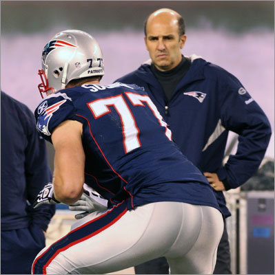 Dr. Thomas Gill watching Nate Solder (#77, Patriots) from the sideline.